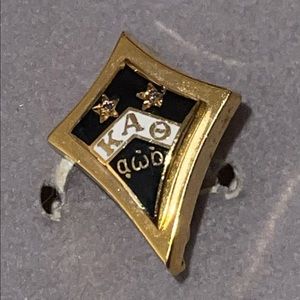 Kappa Alpha Theta sorority pin.